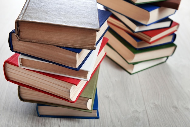 Stacks of books on wooden background