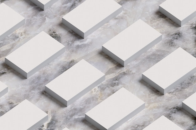 Stacks of business cards on marble surface.