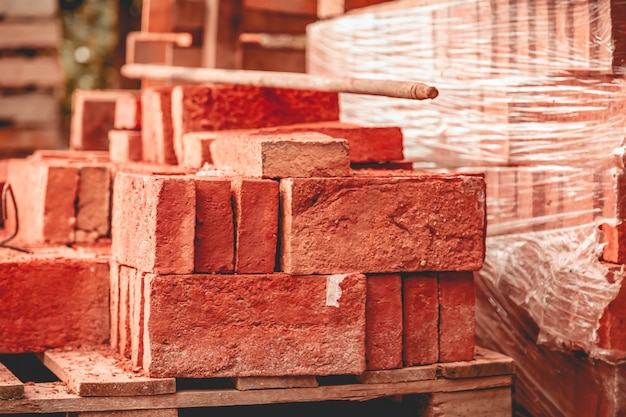 Stacks of orange bricks in a heap texture