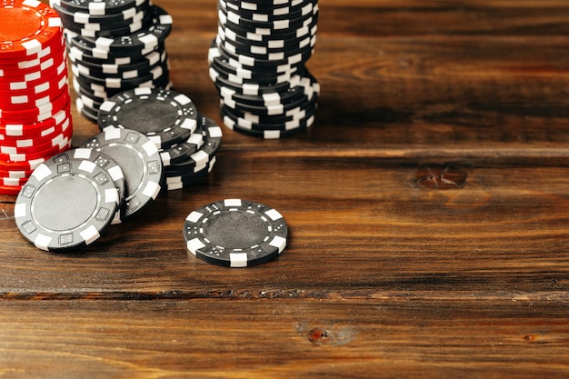 Stacks of poker chips on table close up