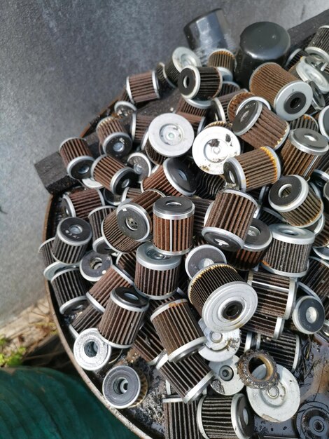 stacks of thrown away car oil filter cylindrical outdoor