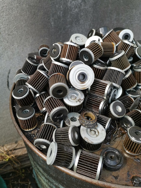 stacks of thrown away car oil filter cylindrical outdoor