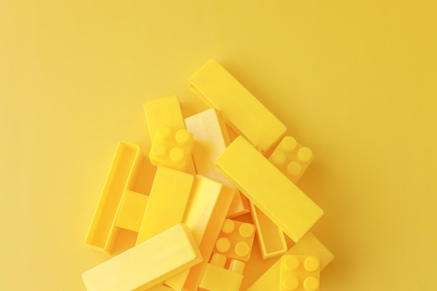 Stacks of yellow blocks on yellow background Creative monochrome yellow mood Cute wallpaper