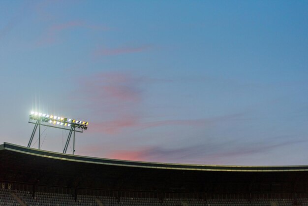 Stadium lights against blue sky