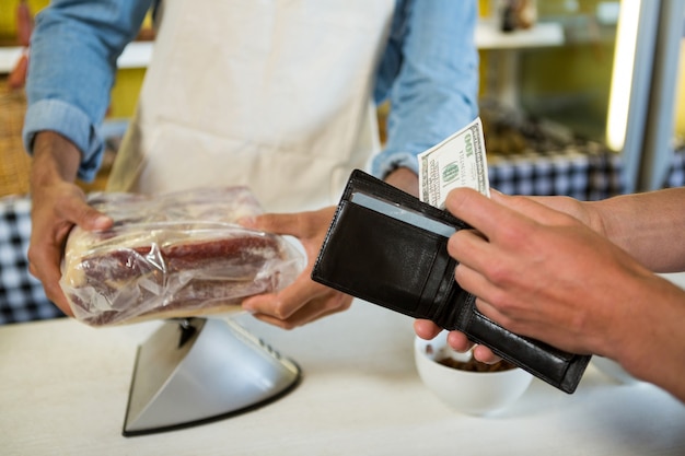 Staff receiving payment from the customer