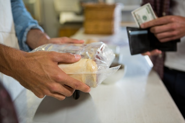 Staff receiving payment from the customer