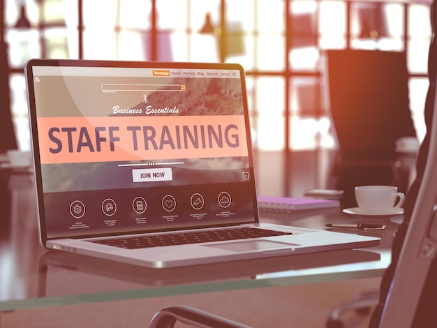 Staff Training Concept  Closeup on Laptop Screen in Modern Office Workplace Toned Image with Selective Focus