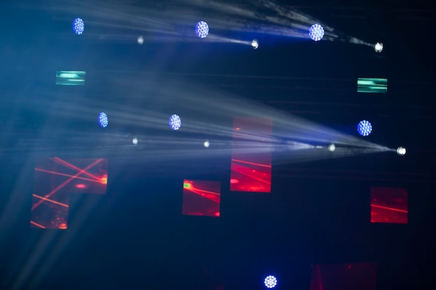 Stage lighting on a dark blue backgroundLight show