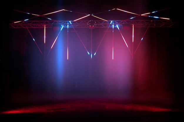 Stage lighting with pink and blue laser lights Dark stage background