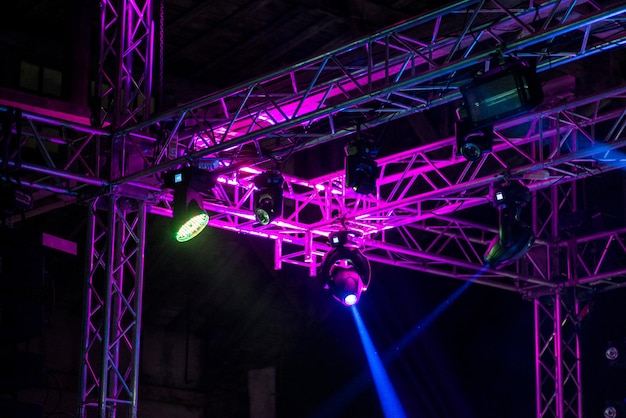 Stage lights on metal construction during a concert