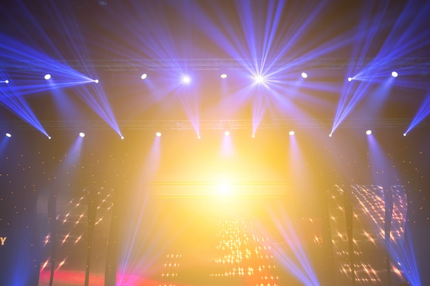 Stage Spotlight with Laser rays. concert lighting background