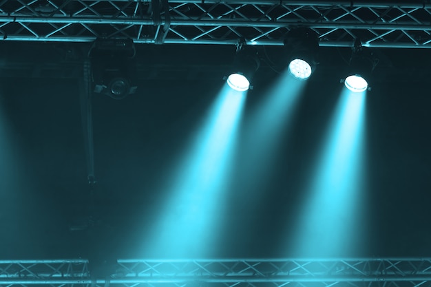 Stage Spotlight with Laser rays. concert lighting background