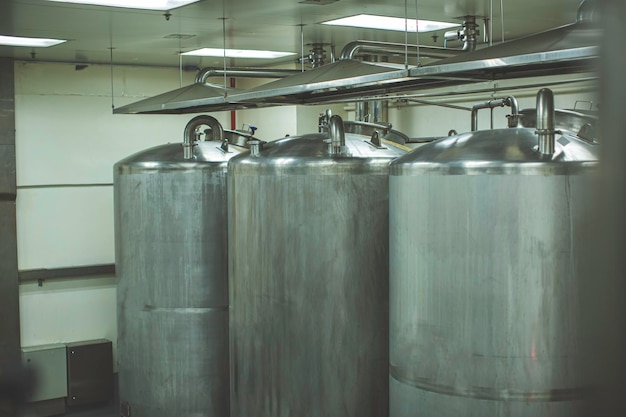 Stainless lid steel tanks with pressure meter in equipment tank
facility for water cleaning and treatment at shampoo plant
