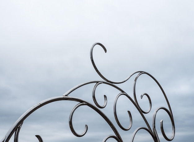 Stainless sculpture in the light fog.