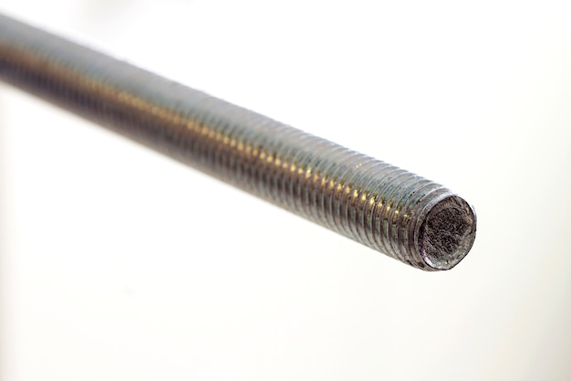 Stainless steel bolts and nuts on a white background. Bolt, washer and nut on a white background. Bolt on a white background. Bolt screw nut washer carving.