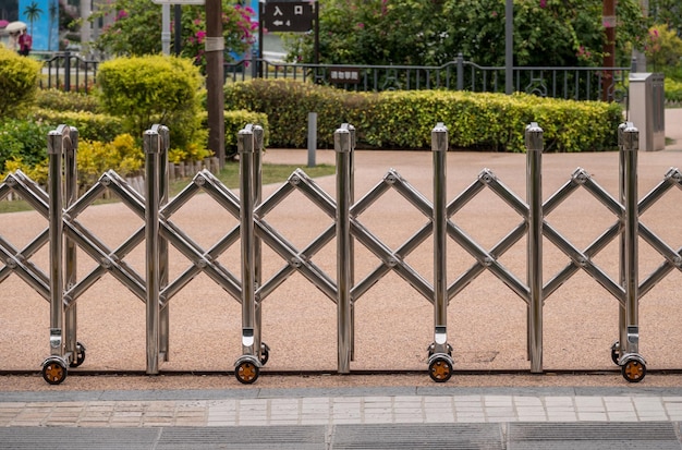 Stainless steel expandable metal fence or barrier across a street in China