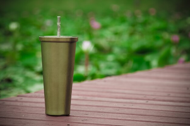 Stainless steel mug On the wood floor