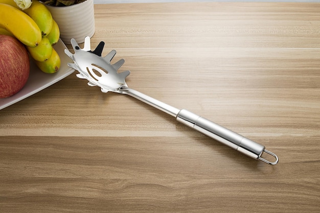 Stainless steel tableware and kitchen utensils placed on the desktop