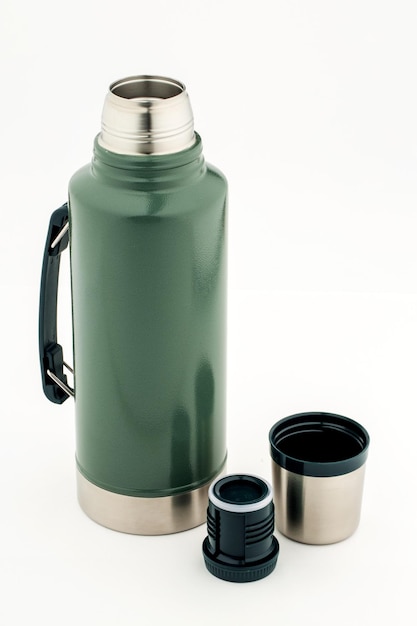 Stainless steel thermos on white background