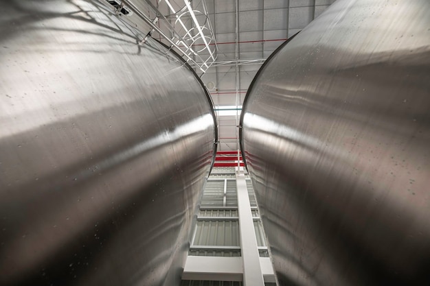 Stainless vertical chemical row tanks with pressure meter in equipment tank chemical cellar at with stainless steel