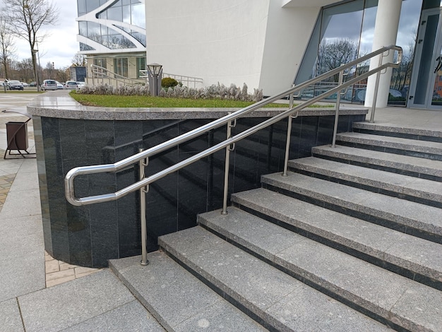 A stair case with a metal handrail on the side of it