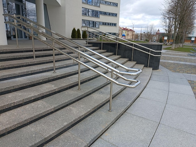 A stair case with a metal handrail