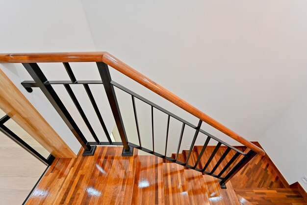 Staircase finished with redcolored wood