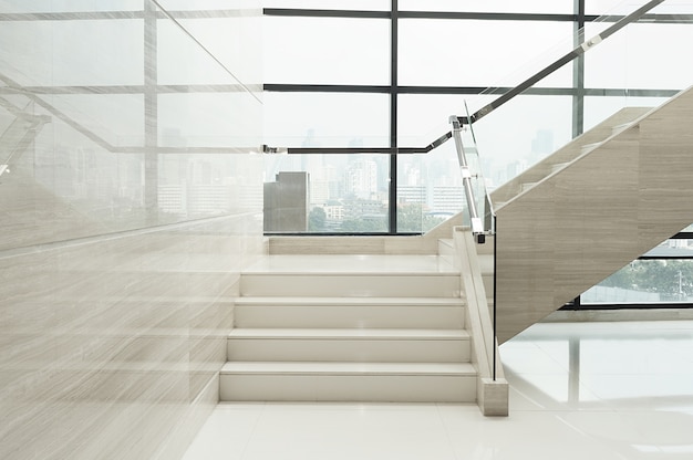 Staircase interior in lobby of hotel with glass window background