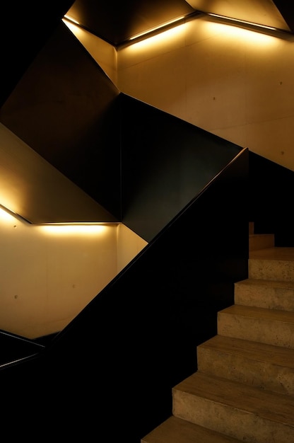 Staircase of the jumex museum with quality light and concrete the handrail is black steel bottom