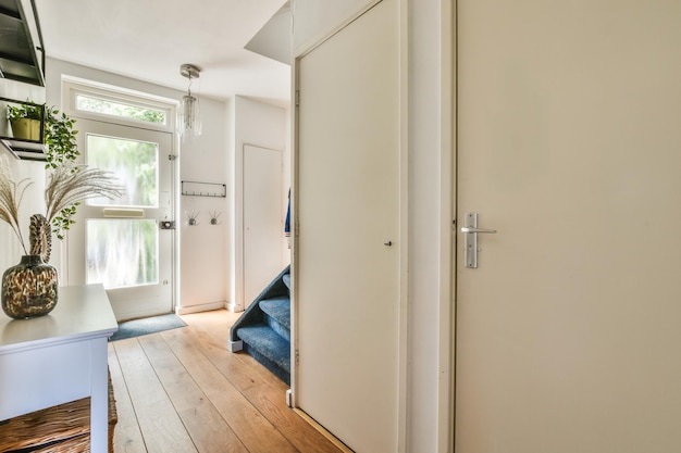 Staircase in spacious hall of apartment