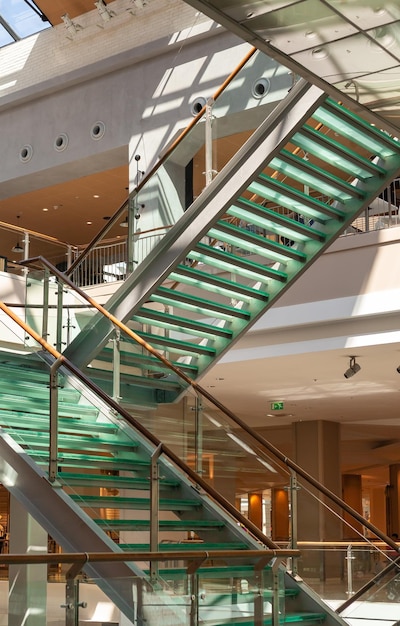Staircase with glass steps in a shopping center