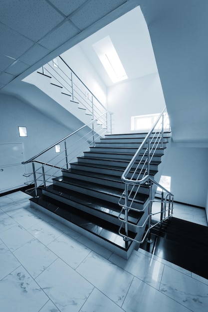 Staircase with a steel handrail