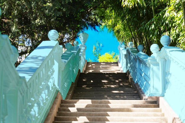 Stairs in the park leading up to the blue sky