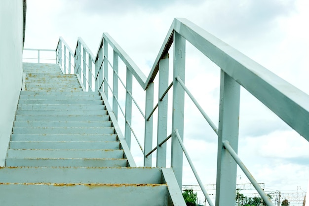 Stairway to Heaven iron staircase to the bridge old iron ladder blue