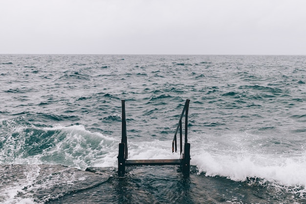 Stairway in the sea water