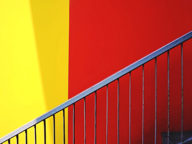 Stairway and Vivid Red and Yellow Wall Background