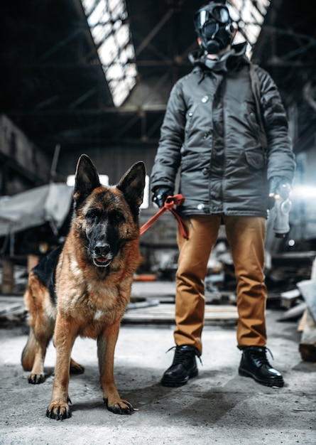 Photo stalker in gas mask and dog in radioactive zone