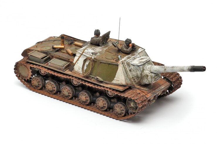 Photo stand model of a military battle tank on a white surface