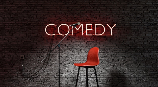 Photo stand-up comedy stage illuminated by a spotlight with the word comedy in red neon lamp