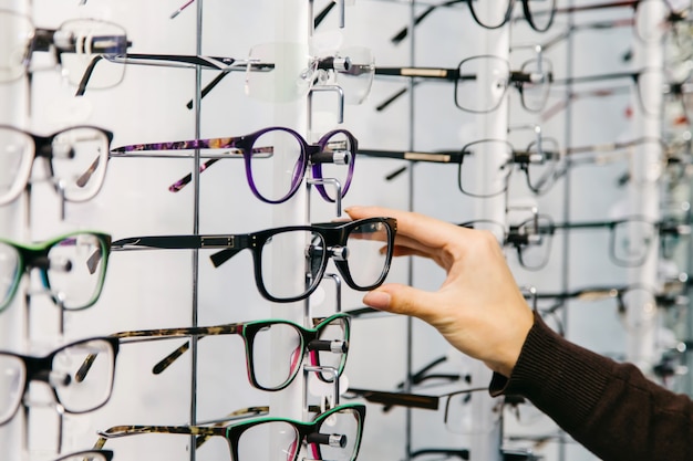 Stand with glasses in the store of optics. 