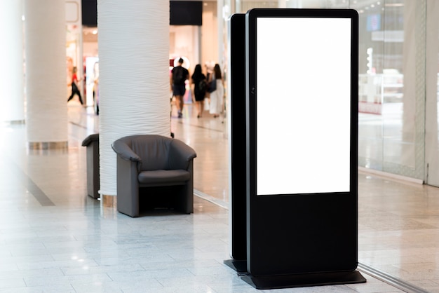 Standing blank billboard inside mall 