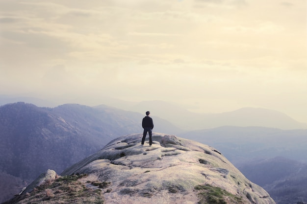 Standing on the top of the mountain