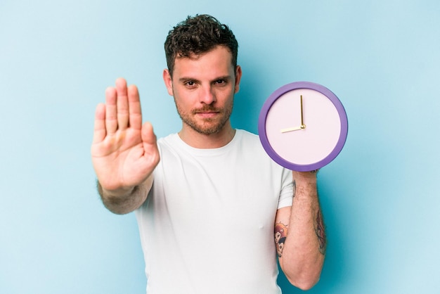 Standing with outstretched hand showing stop sign preventing you