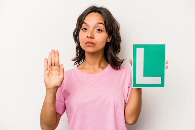 Standing with outstretched hand showing stop sign preventing you