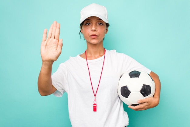 Standing with outstretched hand showing stop sign preventing\
you