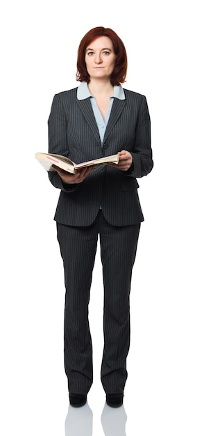 Standing young woman with book isolated on white