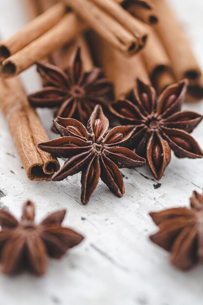 Star anise and cinnamon on white wood