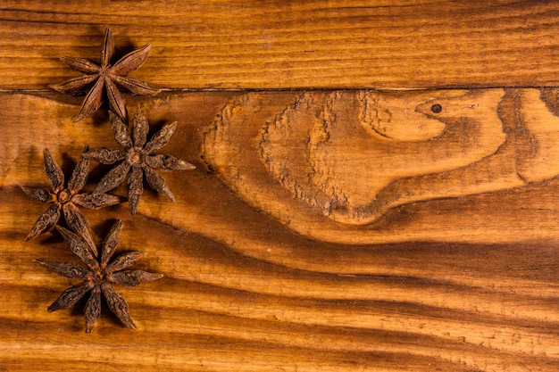 Star anise on rustic wooden table. Top view