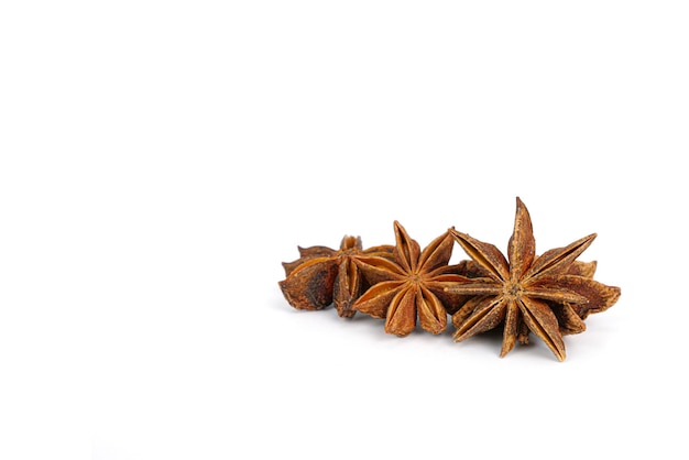 Star anise spice close-up on white background.