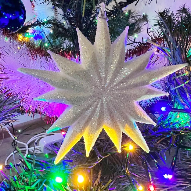 A star hangs on a festive tree